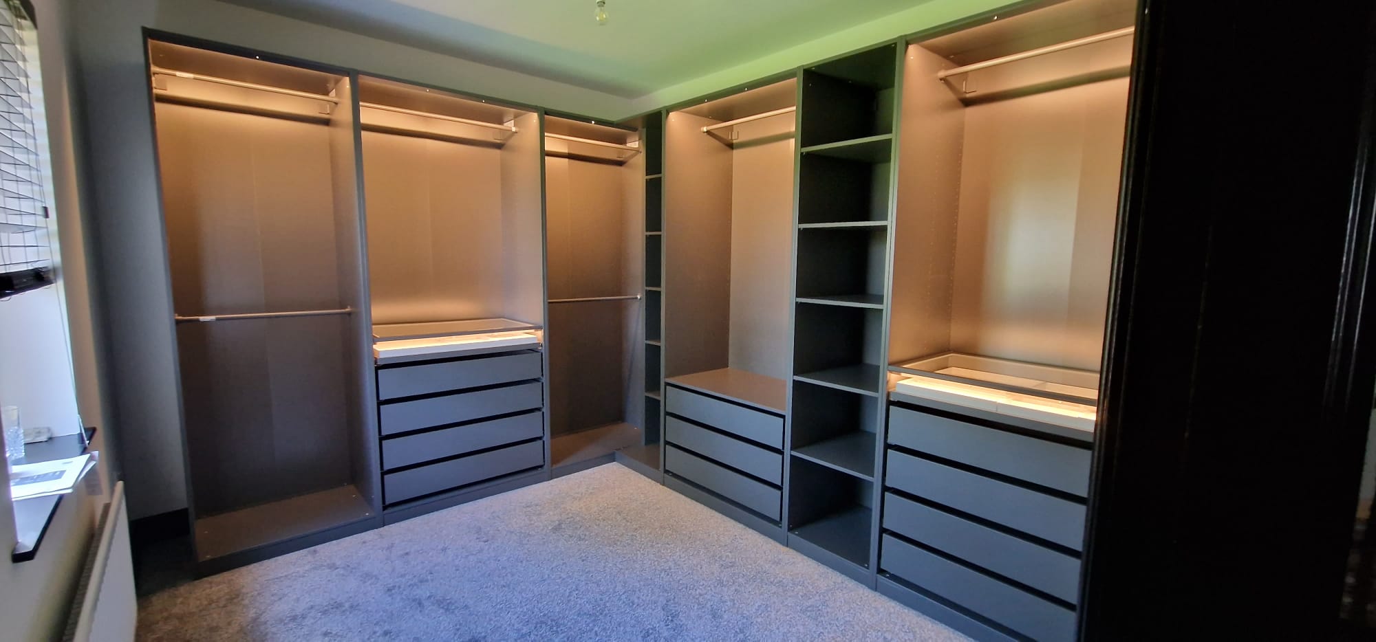 corner wardrobe with built in storage solutions